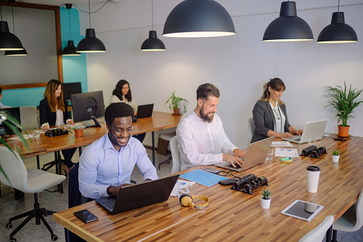 Prime Routes Transport team collaborating in a modern office